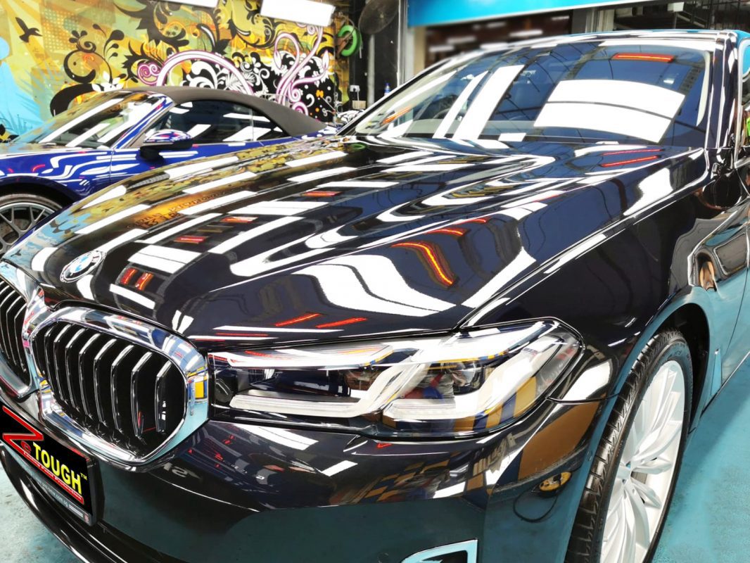 The BMW 520i from a side angle after the titanium coating.