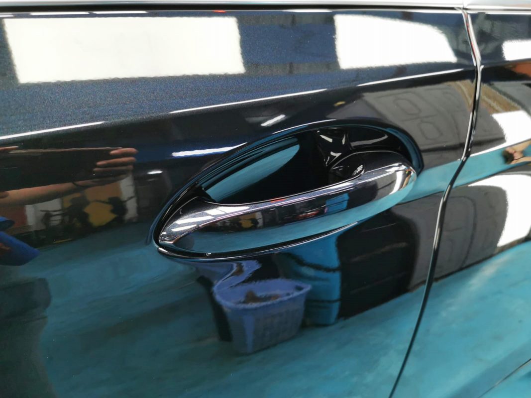 Front three-quarter view of the BMW 520i after coating.