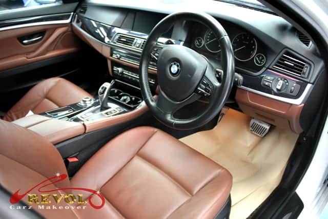 Front three-quarter view of the BMW 520i after coating.