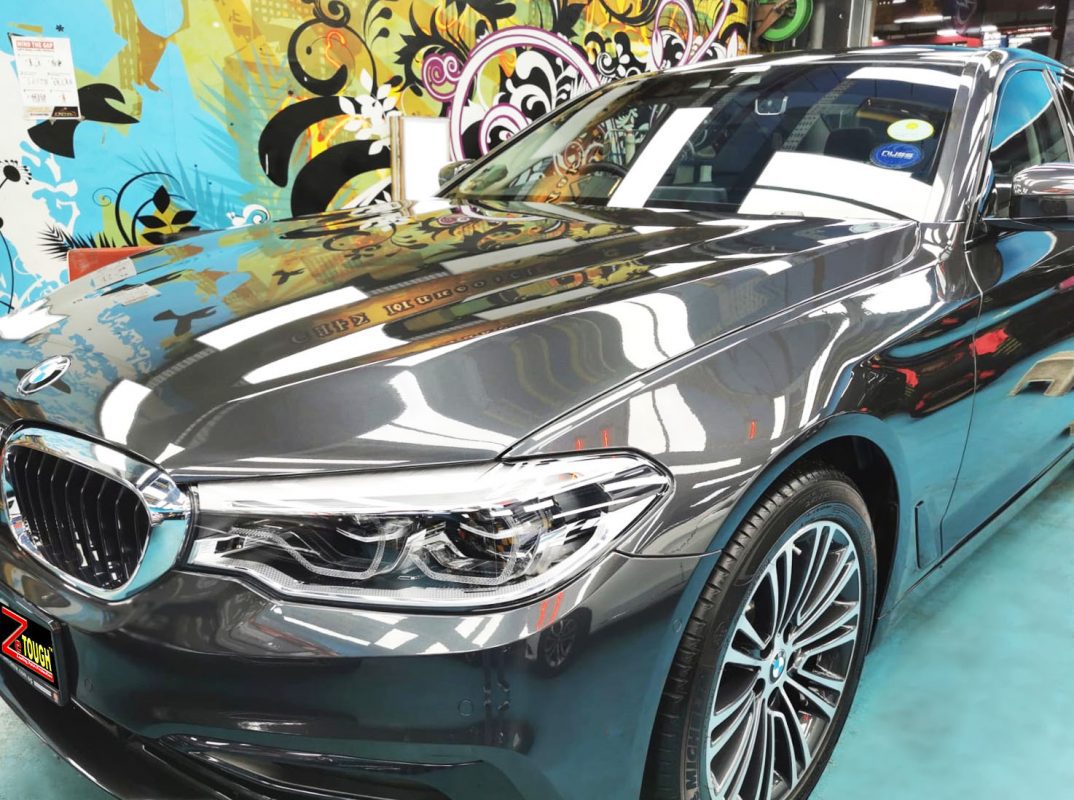 The BMW 520i from a side angle after the titanium coating.