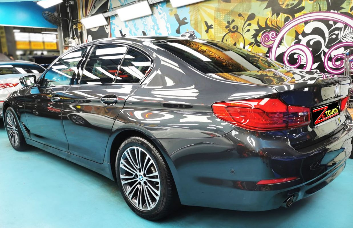 Rear quarter of the BMW 520i, glossy and protected.