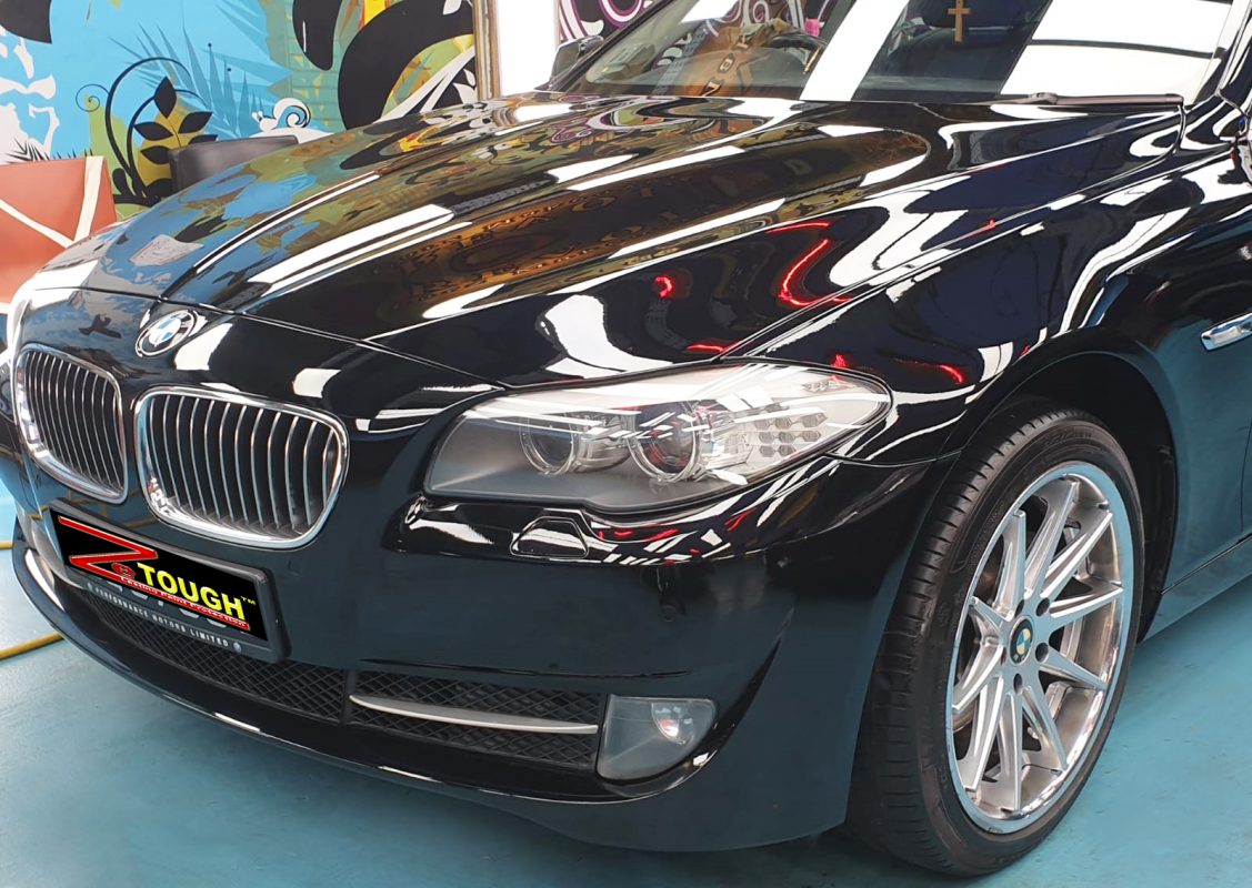 The BMW 523i from a side angle after the titanium coating.
