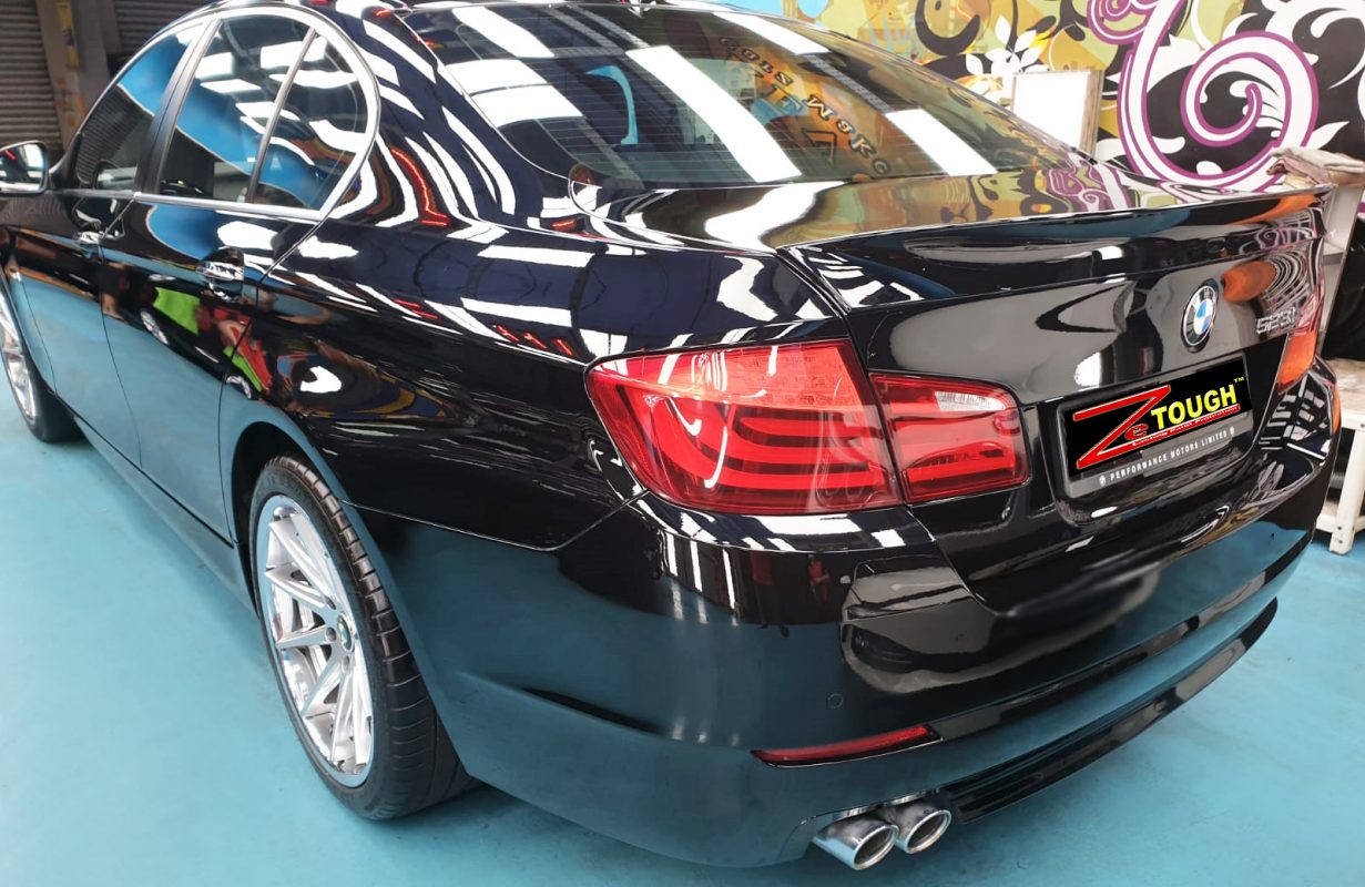 Front three-quarter view of the BMW 523i after coating.