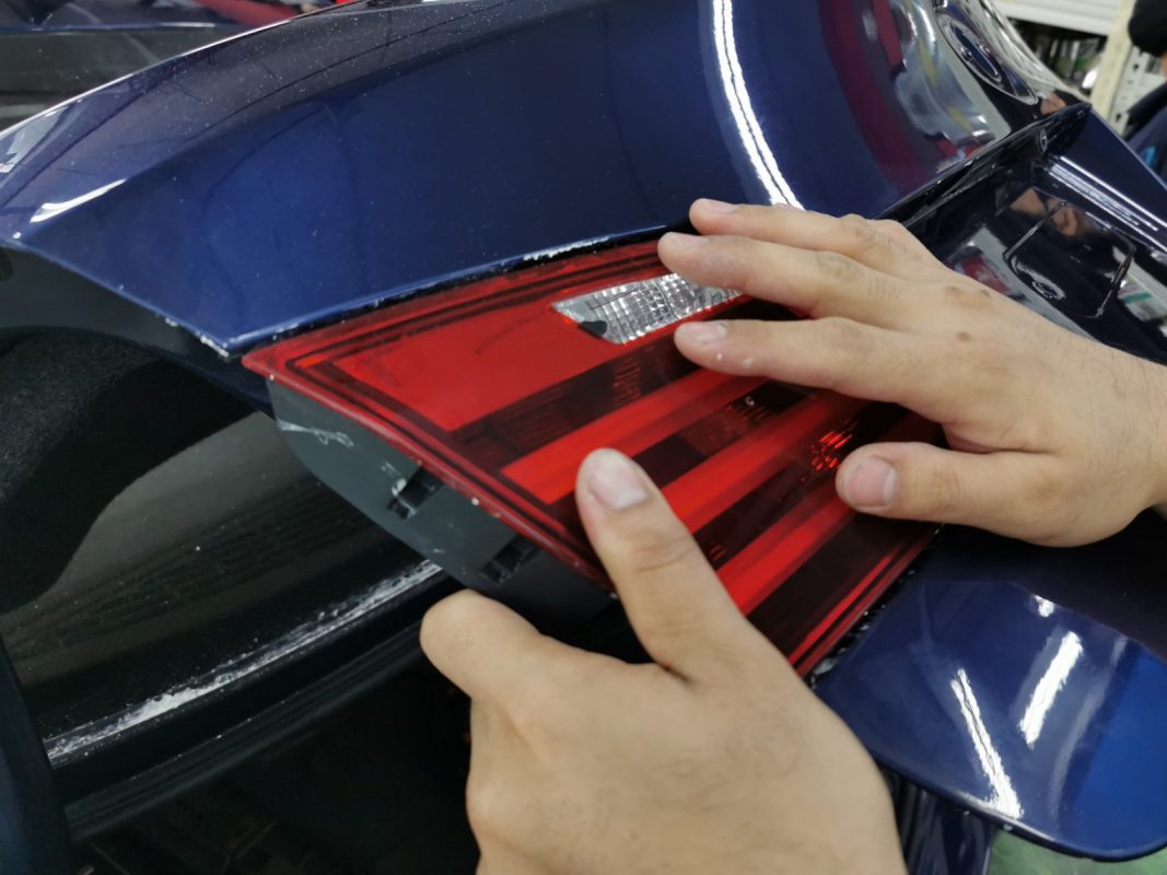 Polishing the new paint on the 523i to bring up the shine.