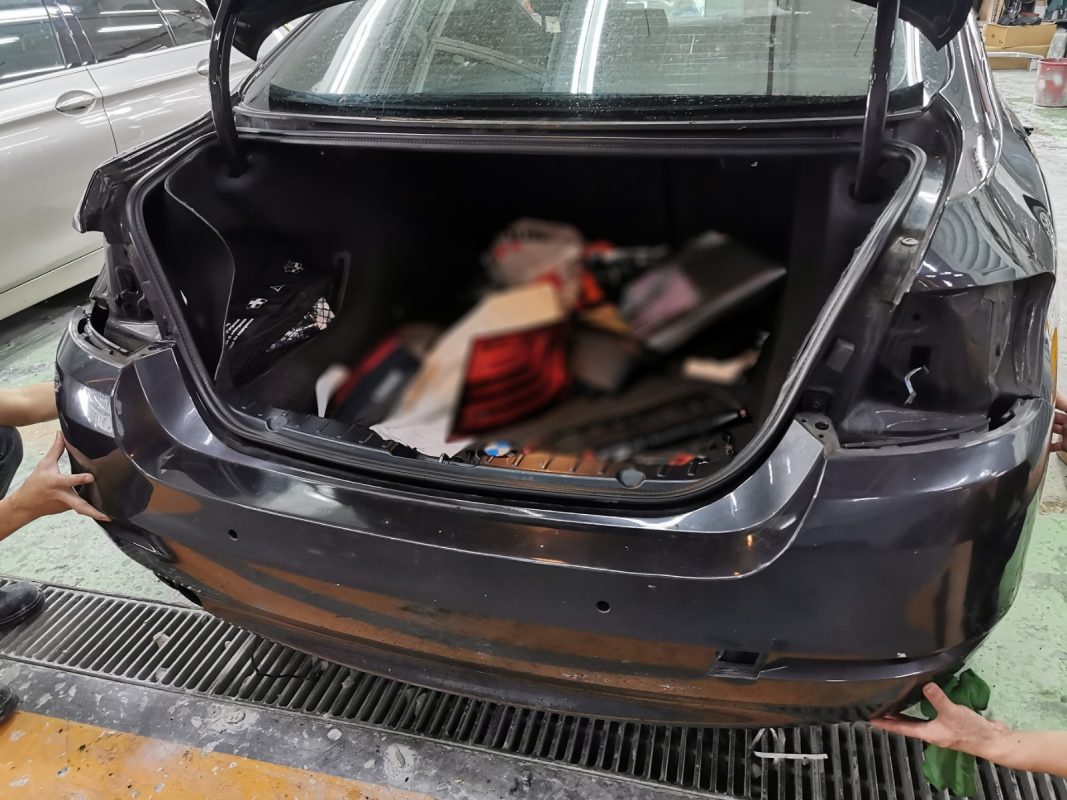 Further strip-down of the BMW 528i, door panels and components exposed.