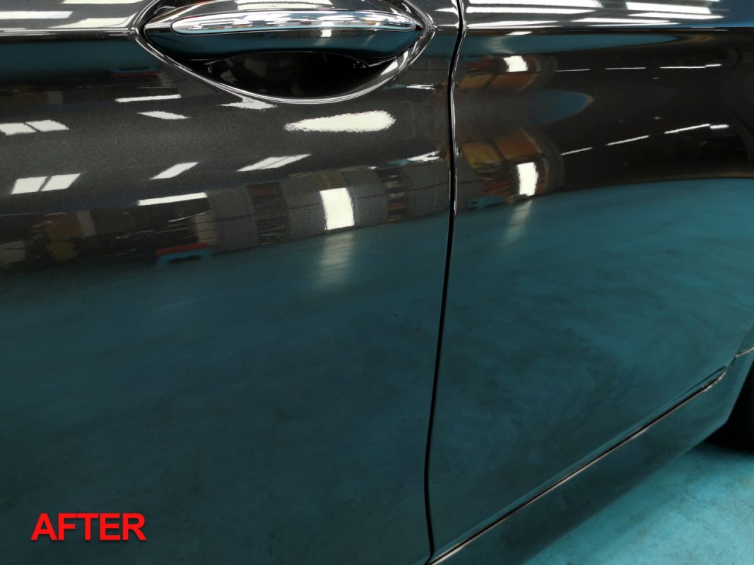 Detail view of the BMW 528i's finished paintwork after the full respray.