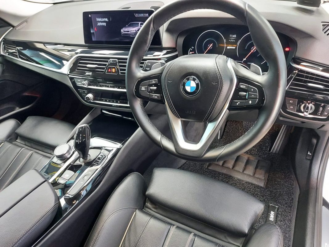 The BMW 530e parked in the workshop, freshly coated.