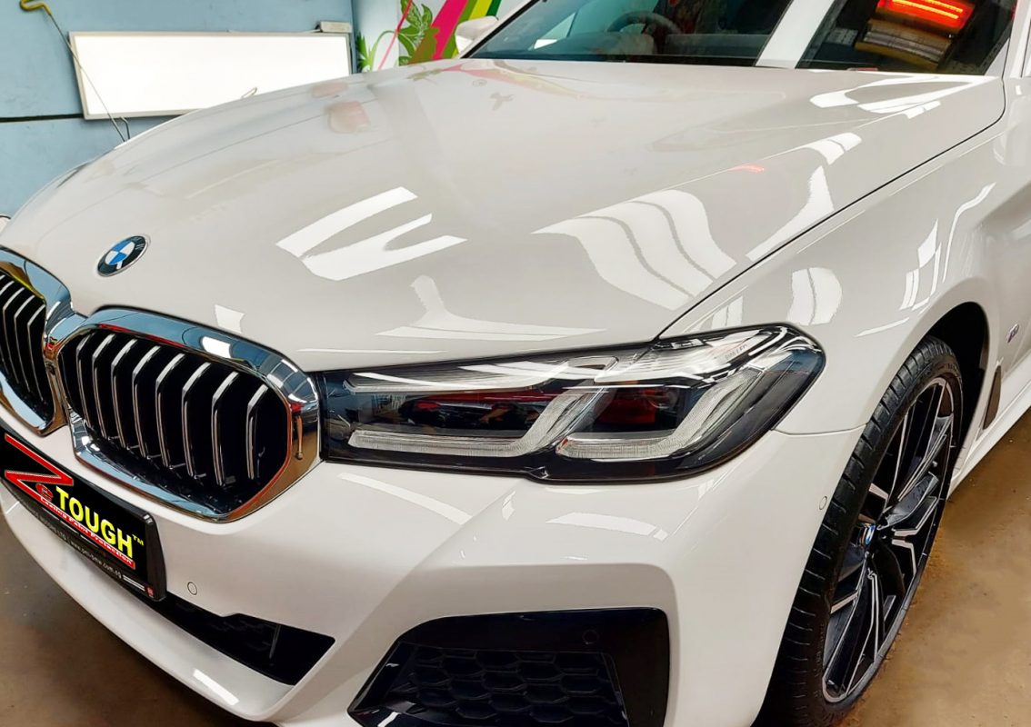 The BMW 530i from a side angle after the titanium coating.