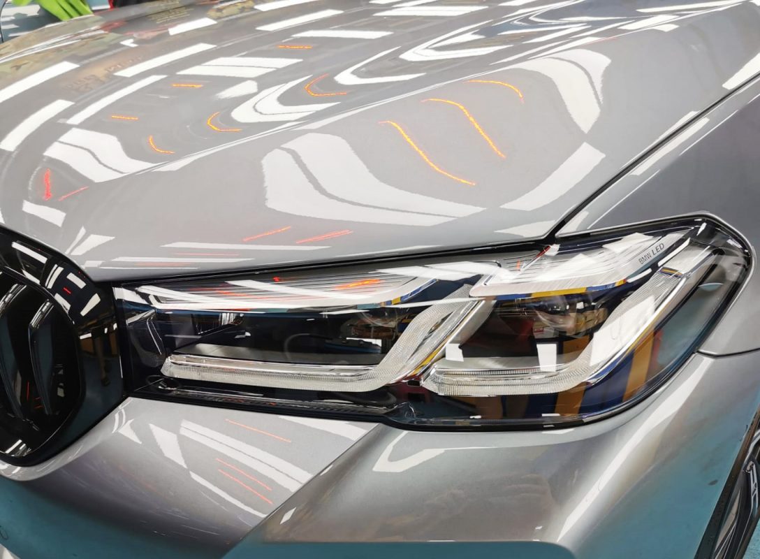 The 530i's coated paintwork showing clean reflections.