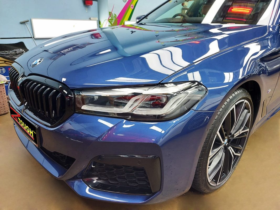 The BMW 530i from a side angle after the titanium coating.