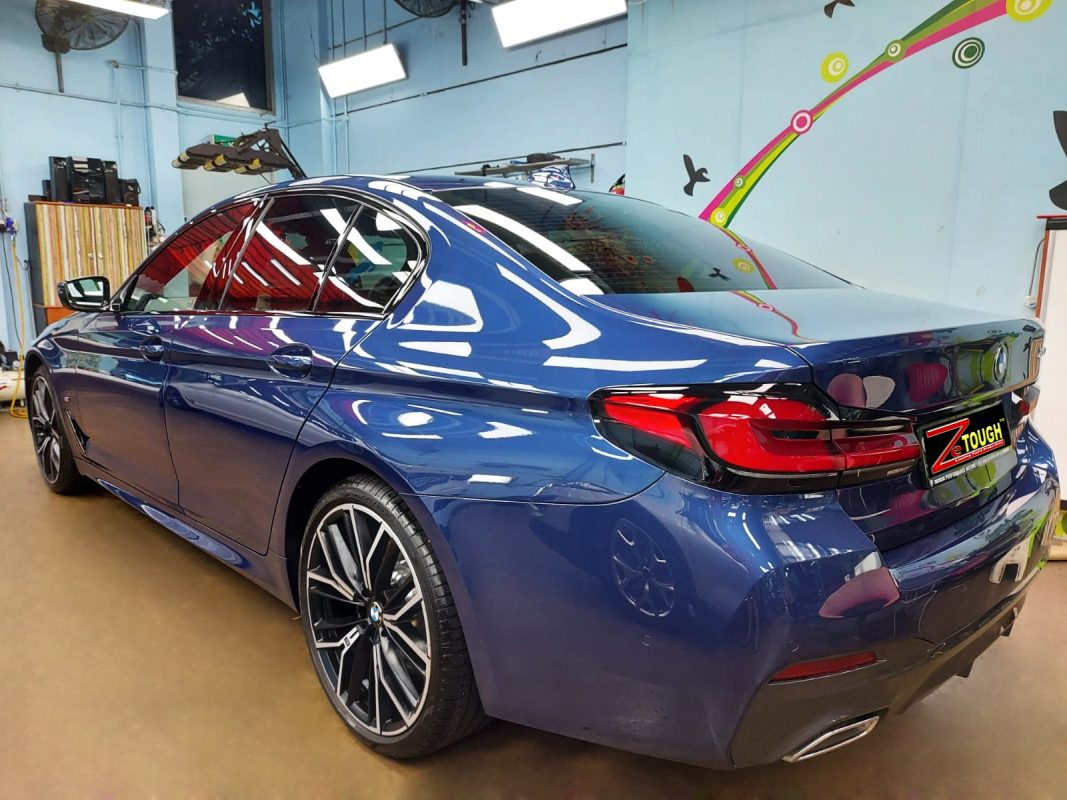 Rear quarter of the BMW 530i, glossy and protected.