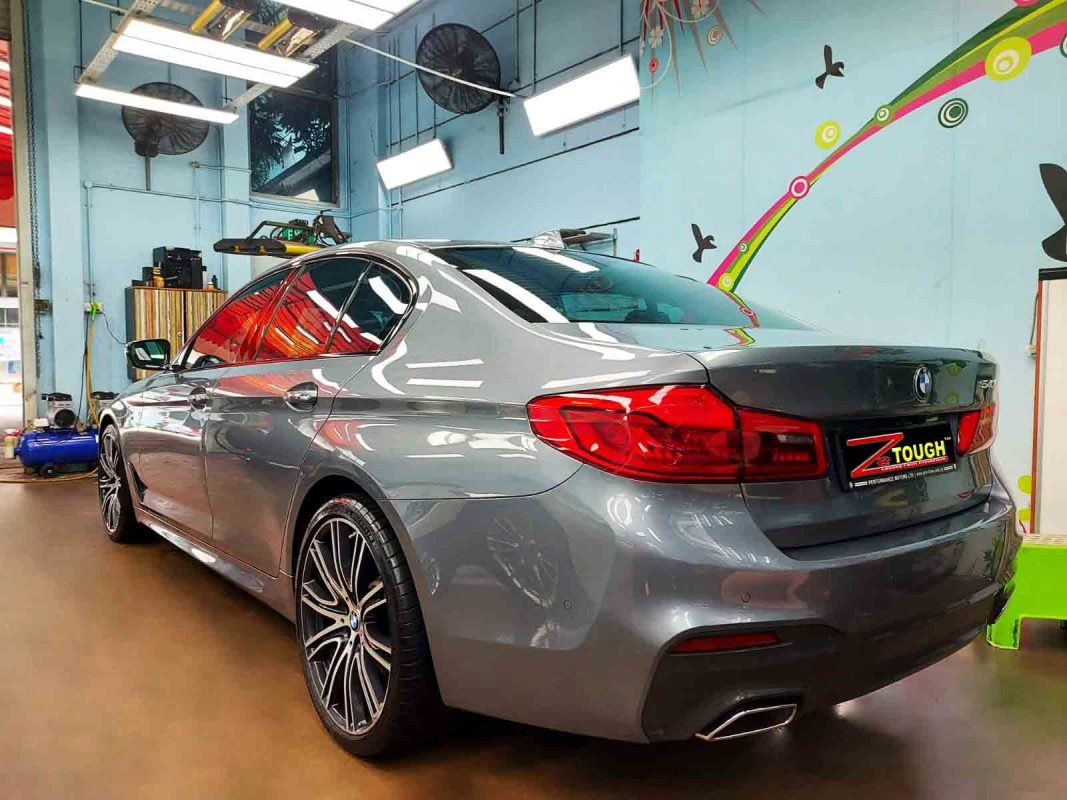 Rear quarter of the BMW 540i, glossy and protected.