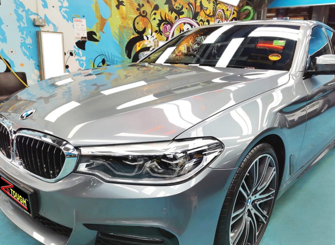 The BMW 540i from a side angle after the titanium coating.