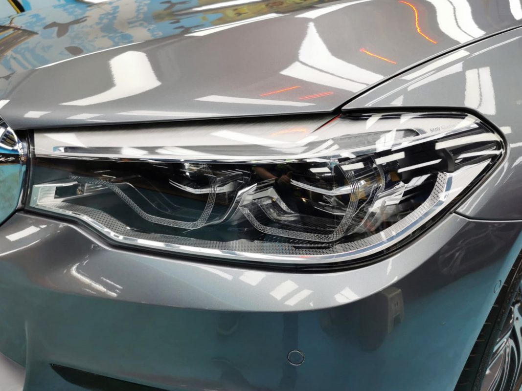 The 540i's coated paintwork showing clean reflections.
