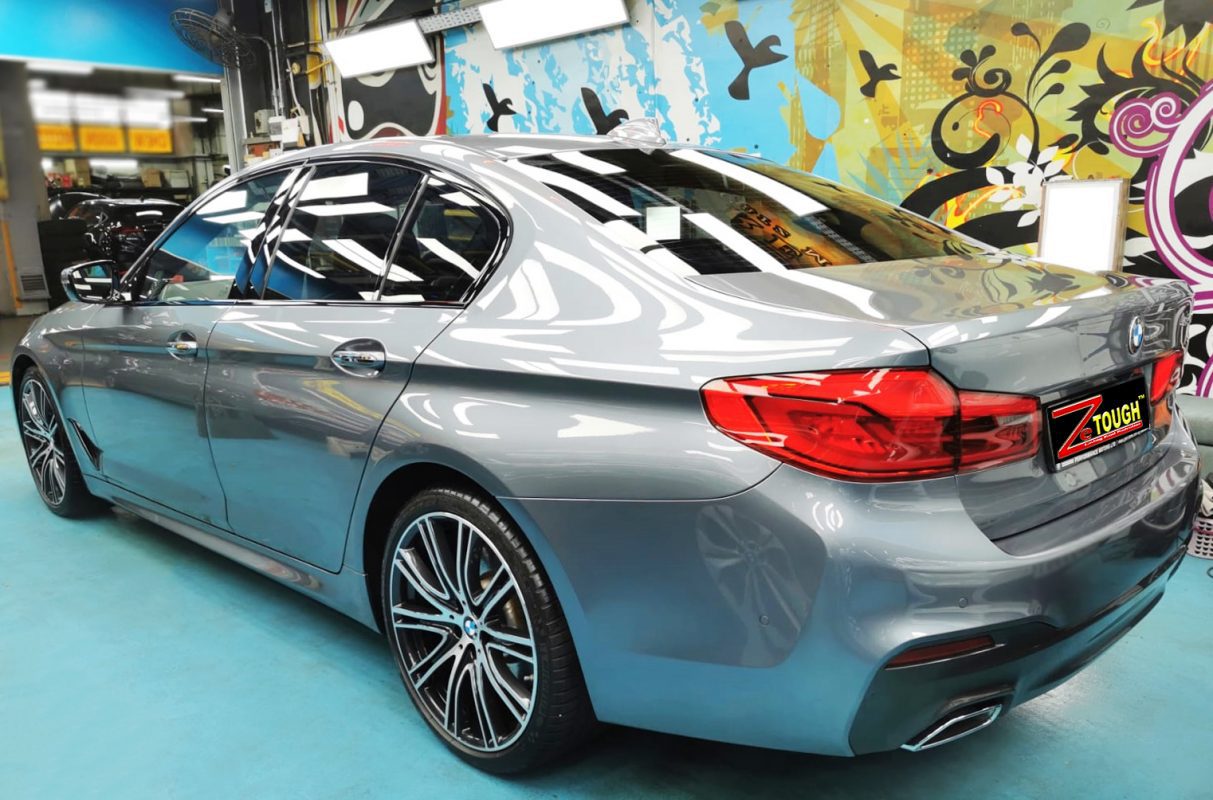 Rear quarter of the BMW 540i, glossy and protected.