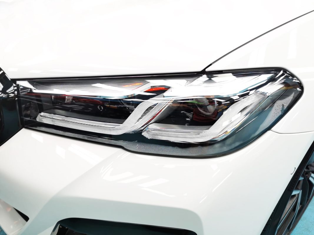 The 5 Series' coated paintwork showing clean reflections.