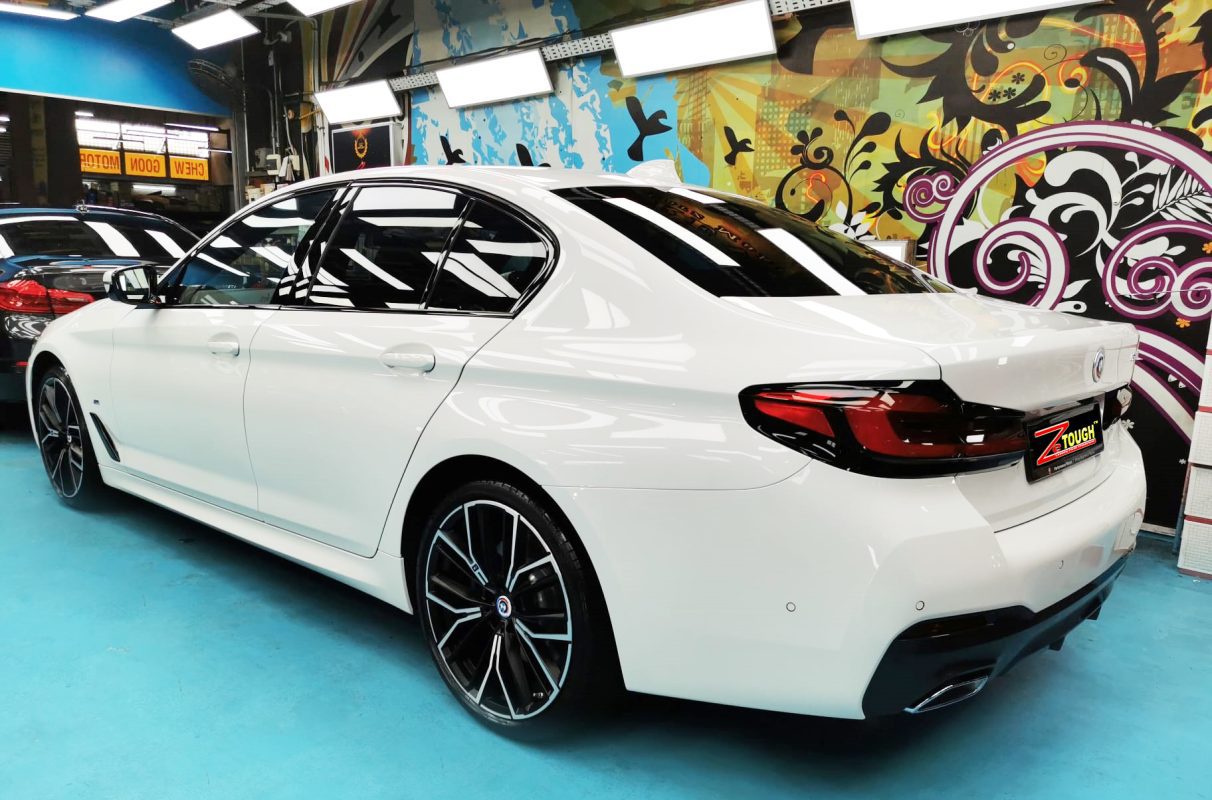 Rear quarter of the BMW 5 Series, glossy and protected.