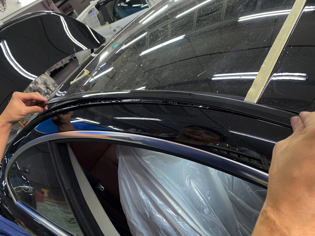Polishing the new paint on the 6 Series to bring up the shine.