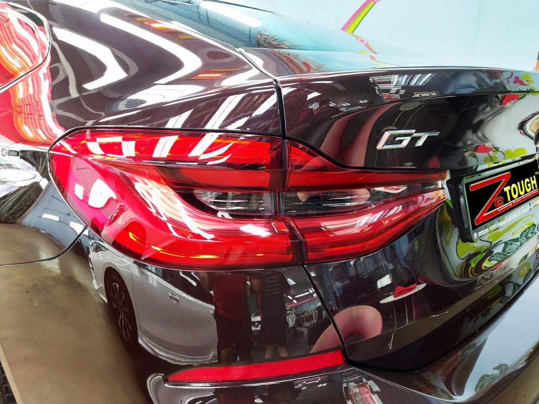 The coated bonnet of the BMW 630i GT under workshop lighting.