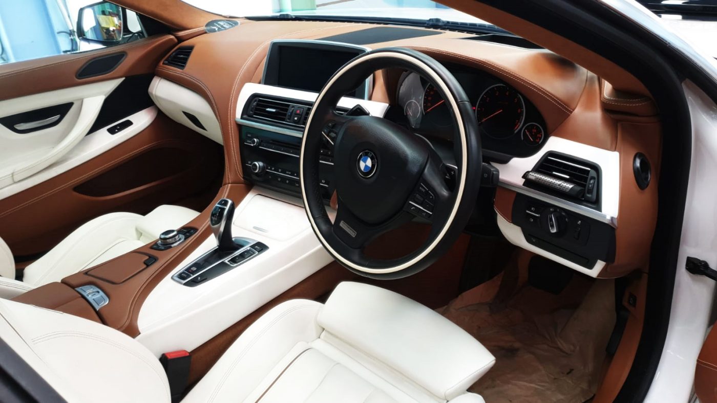 The BMW 640i parked in the workshop, freshly coated.
