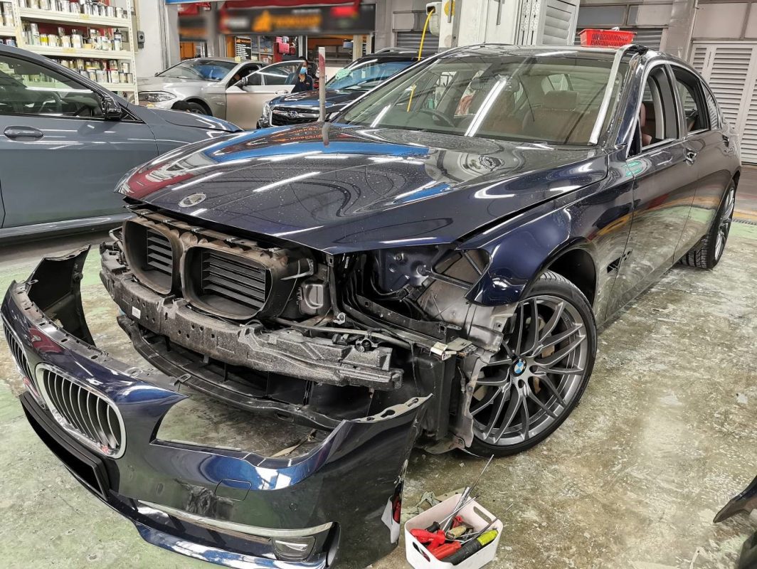 The BMW 7 Series from a side angle after restoration and coating.
