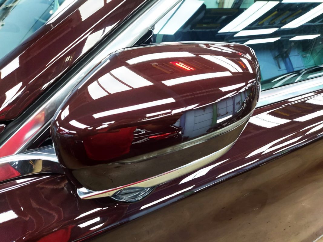 Rear quarter of the BMW 730i, glossy and protected.