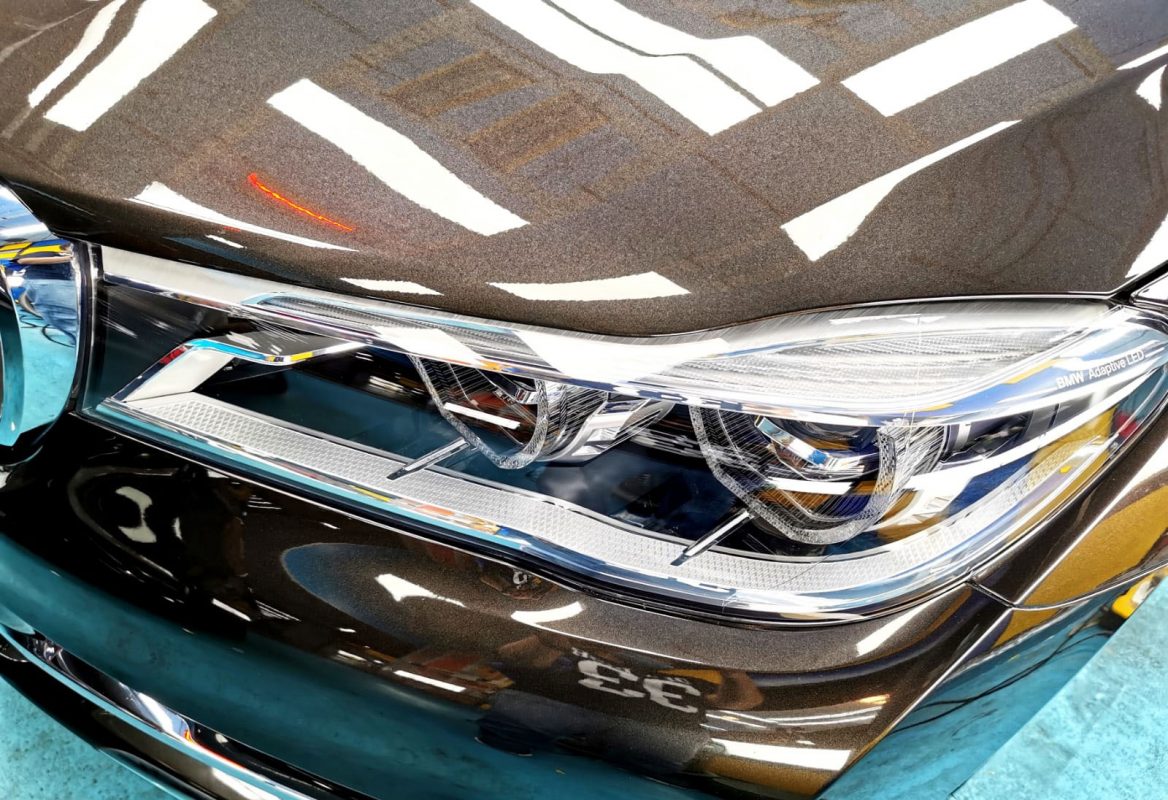 Rear quarter of the BMW 730Li, glossy and protected.