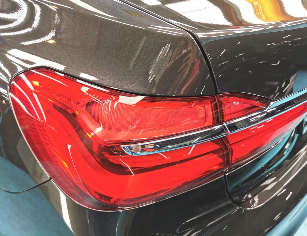 The 730Li's coated bonnet under workshop lighting.