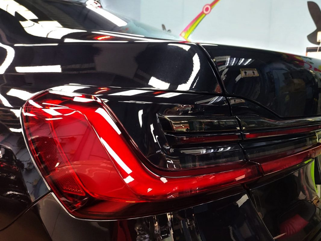 The bonnet of the 730Li under workshop lighting.