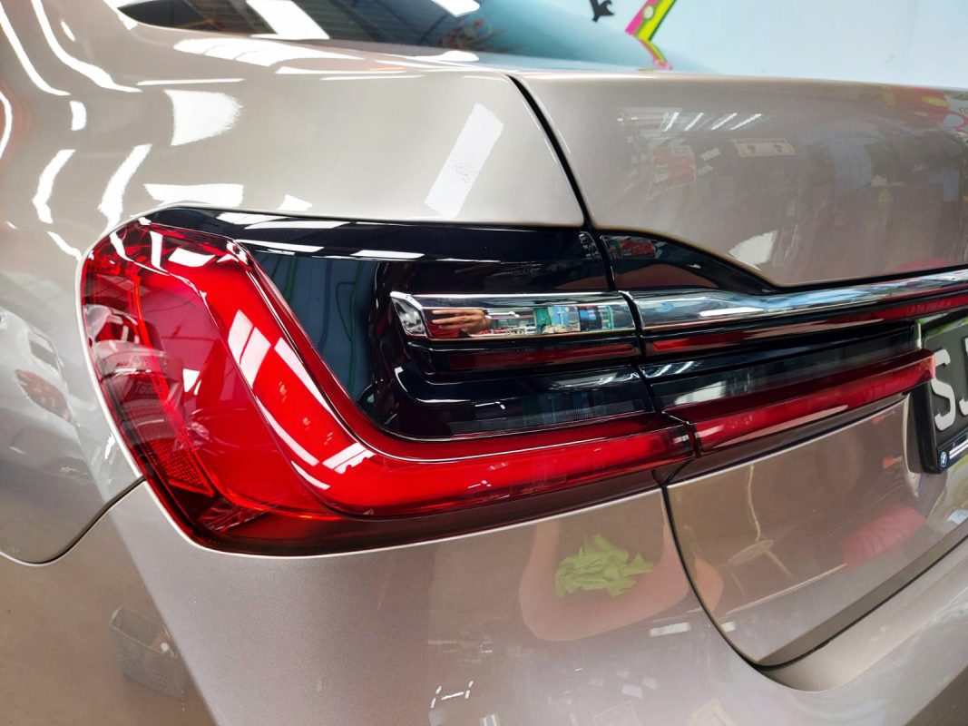 The bonnet of the 730Li under workshop lighting.