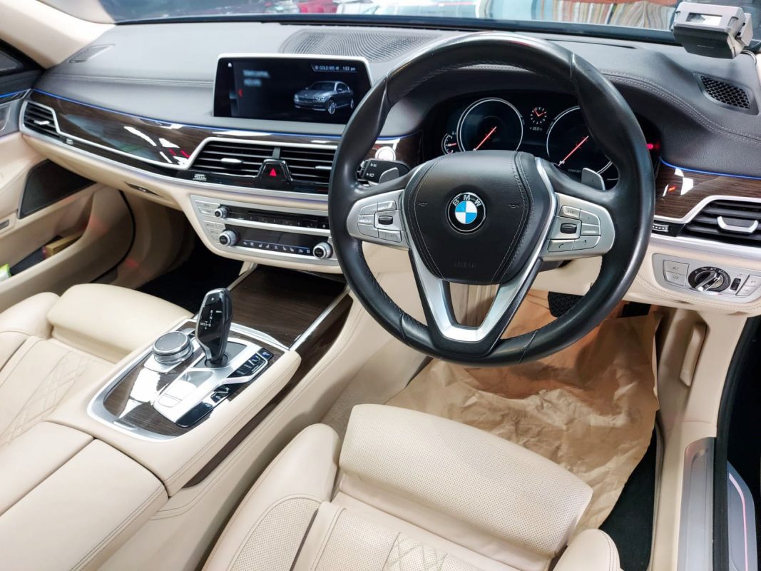 The BMW 740Li parked in the workshop, freshly coated.