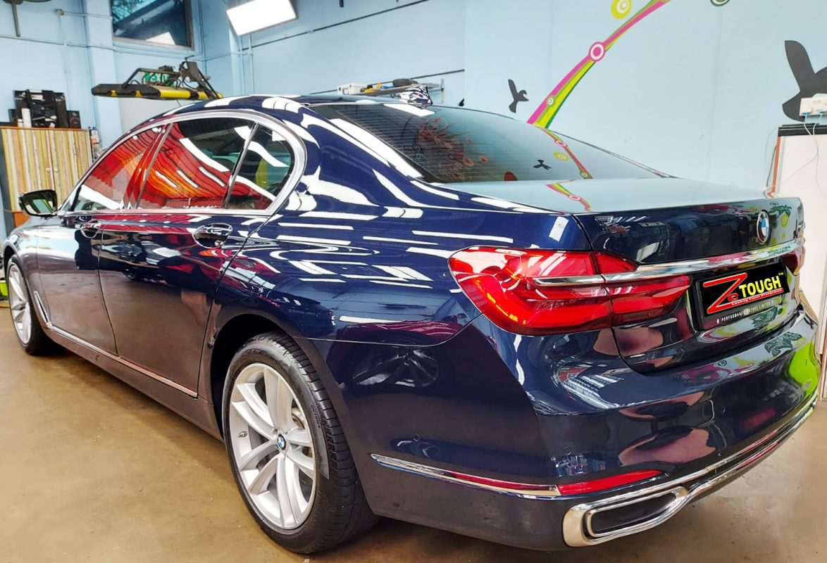 Rear quarter of the BMW 740Li, glossy and protected.