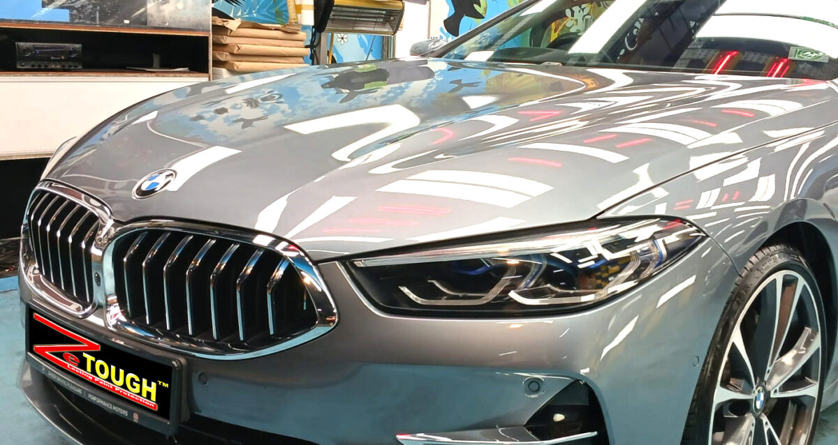 The BMW 8 Series from a side angle after the ceramic coating.