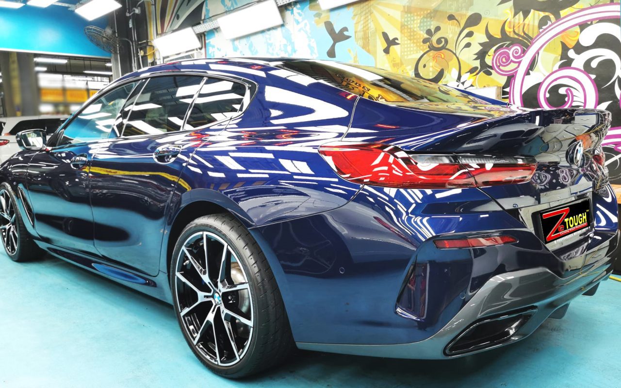 Rear quarter of the BMW 8 Series, glossy and protected.