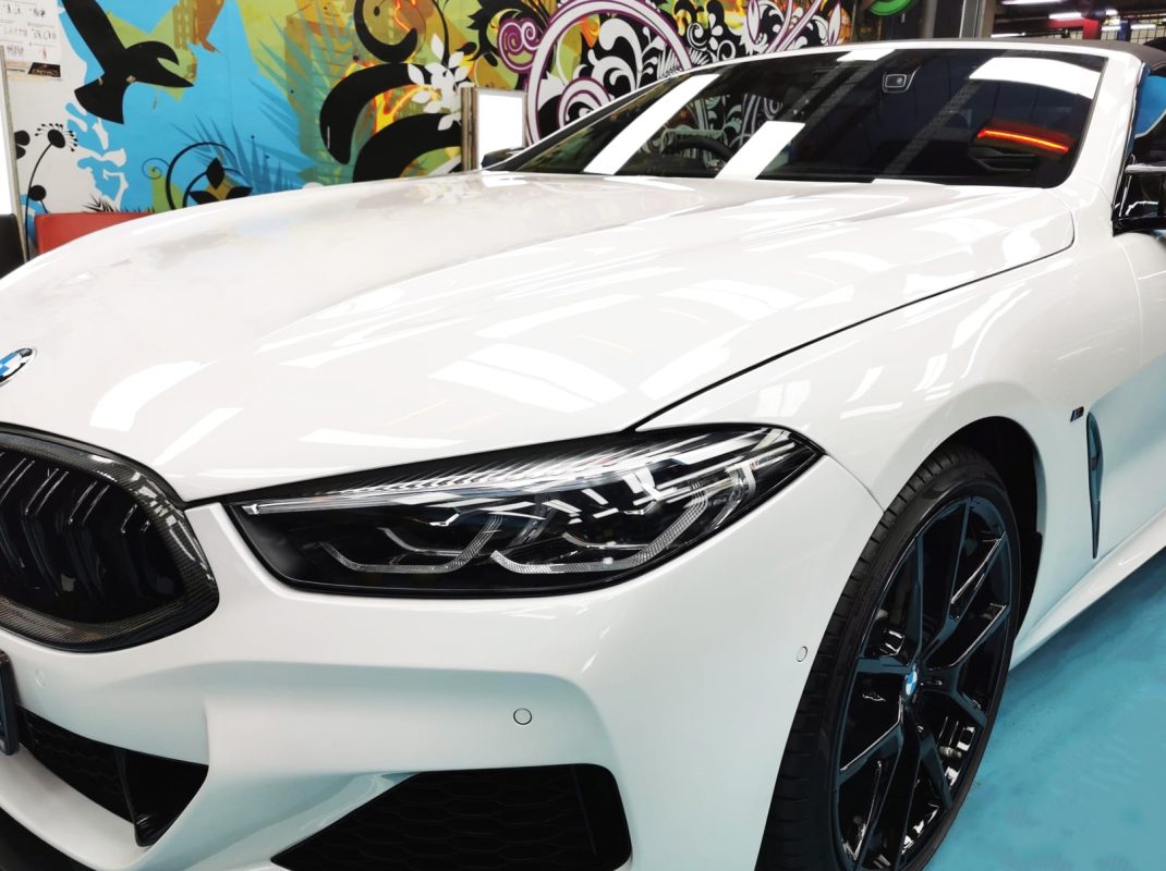 The BMW 840i Cabriolet from a side angle after the ceramic coating.