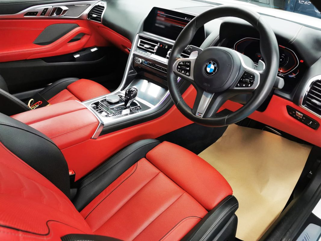 Rear quarter of the BMW 840i Cabriolet, glossy and protected.