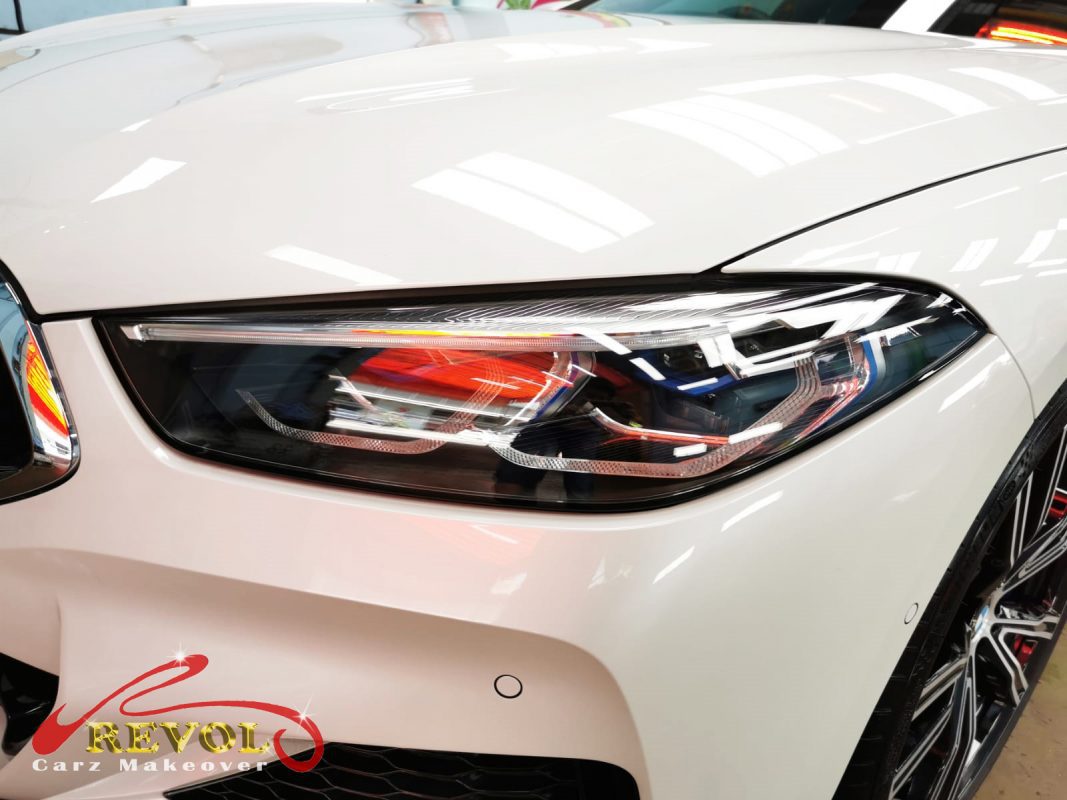 The 840i Gran Coupe's coated paintwork holding clean reflections.
