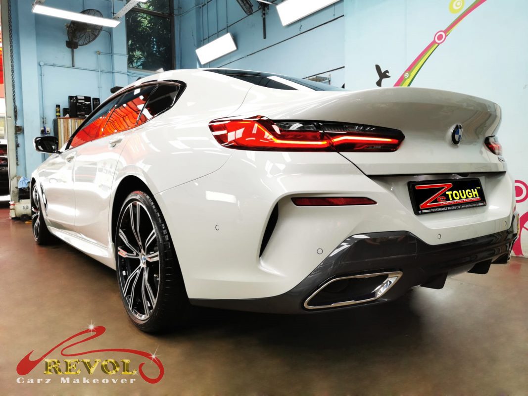 Rear quarter of the BMW 840i Gran Coupe, glossy and protected.