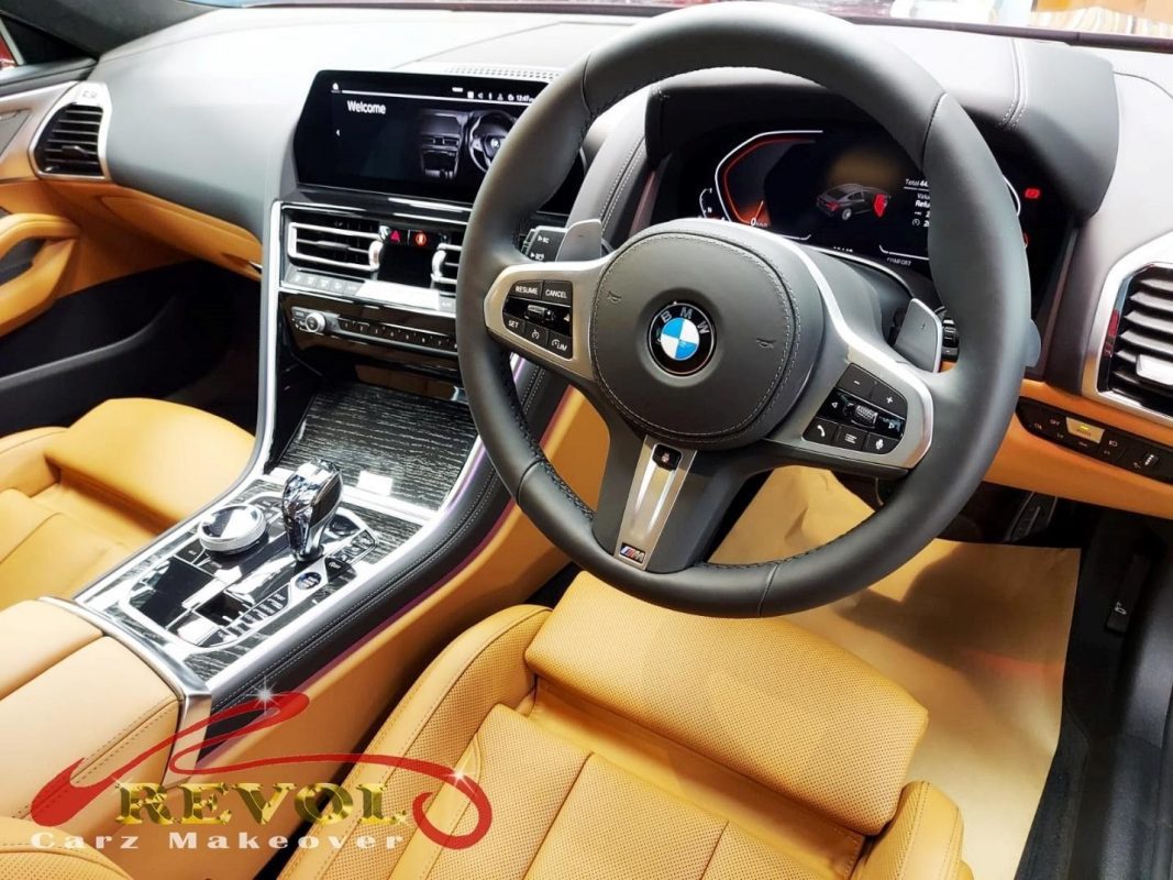 Rear quarter of the BMW 840i M Sport, glossy and protected.