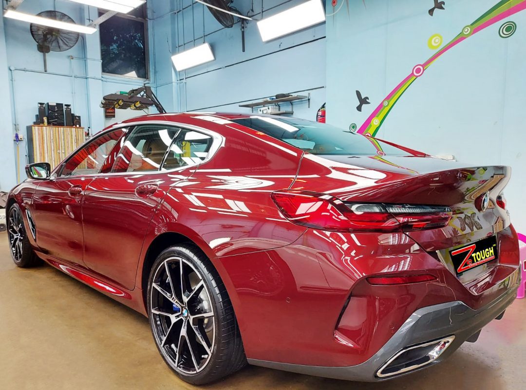 Rear quarter of the BMW 840i, glossy and protected.