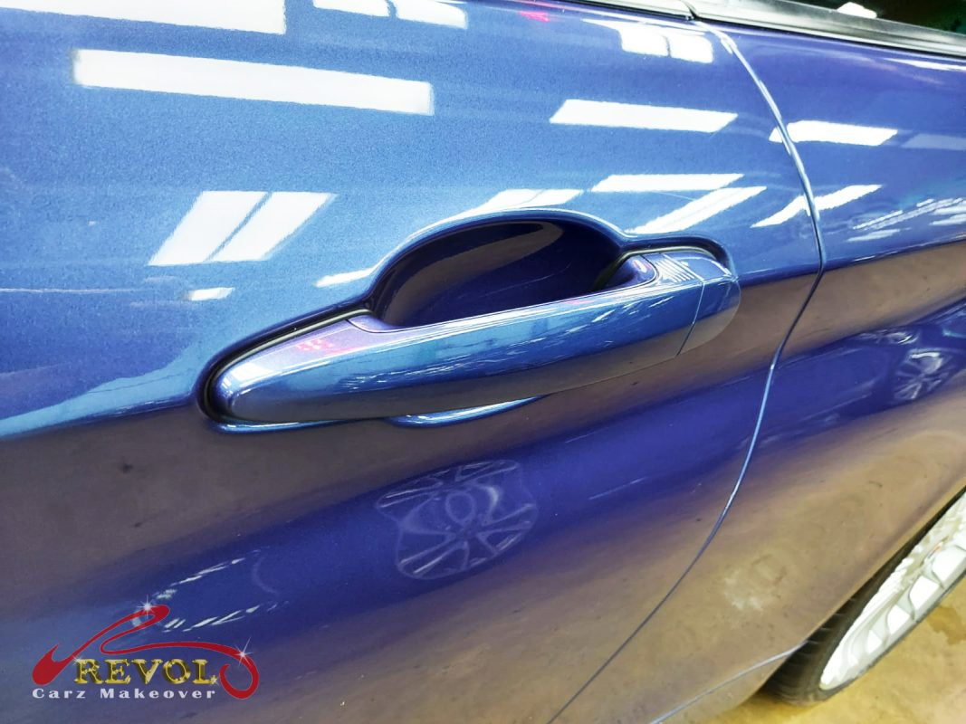 Rear quarter of the Alpina B4, glossy and protected.
