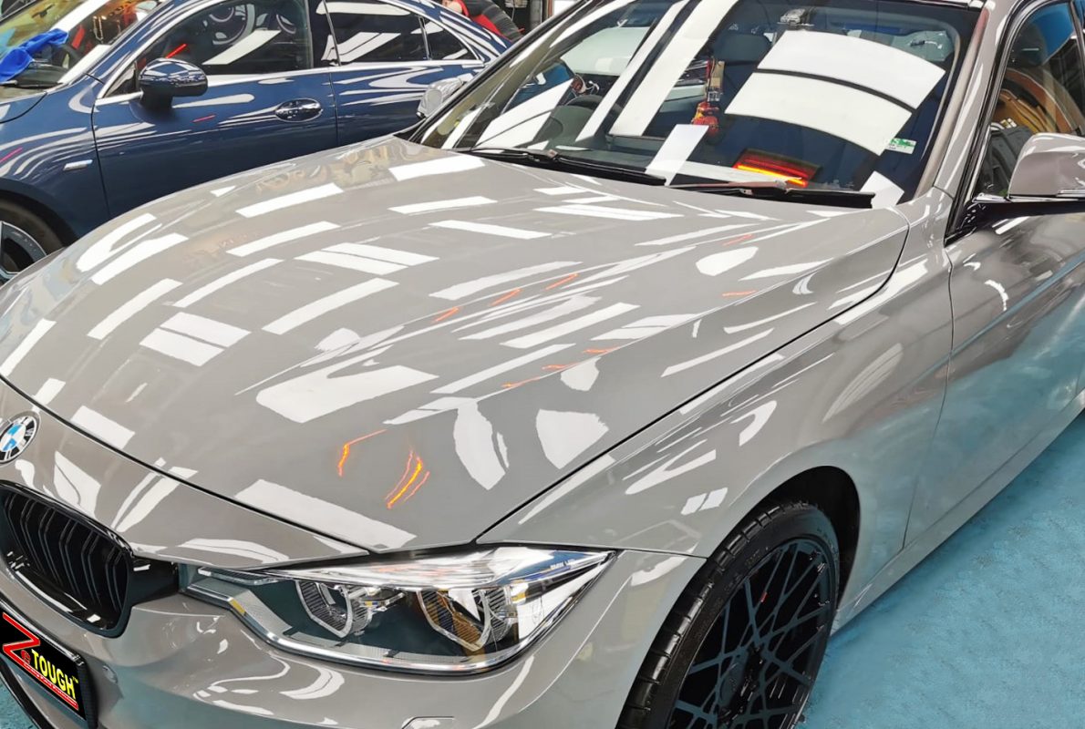 The BMW 330i from a side angle after the ceramic coating.