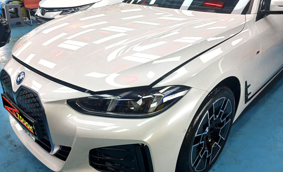 The BMW i4 from a side angle after the titanium coating.
