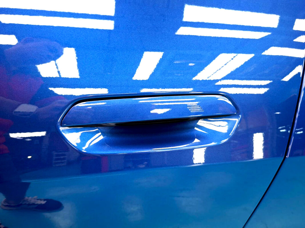The coated paintwork of the BMW i4, clean and sharp.