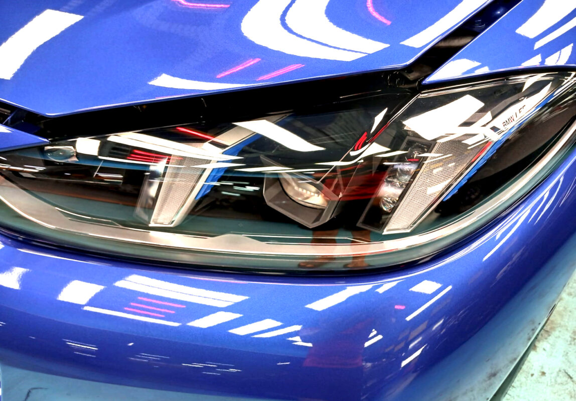 The i4's coated paintwork showing clean reflections.