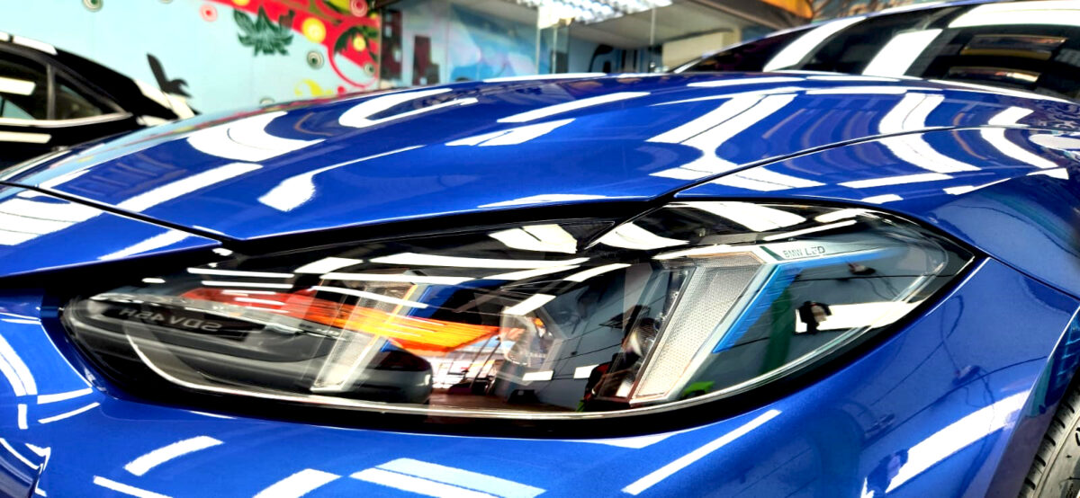 The i4's coated paintwork showing clean reflections.