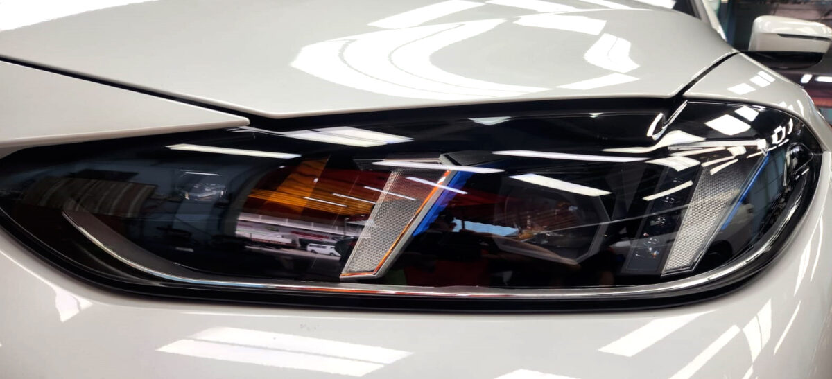 The i4's coated paintwork showing clean reflections.