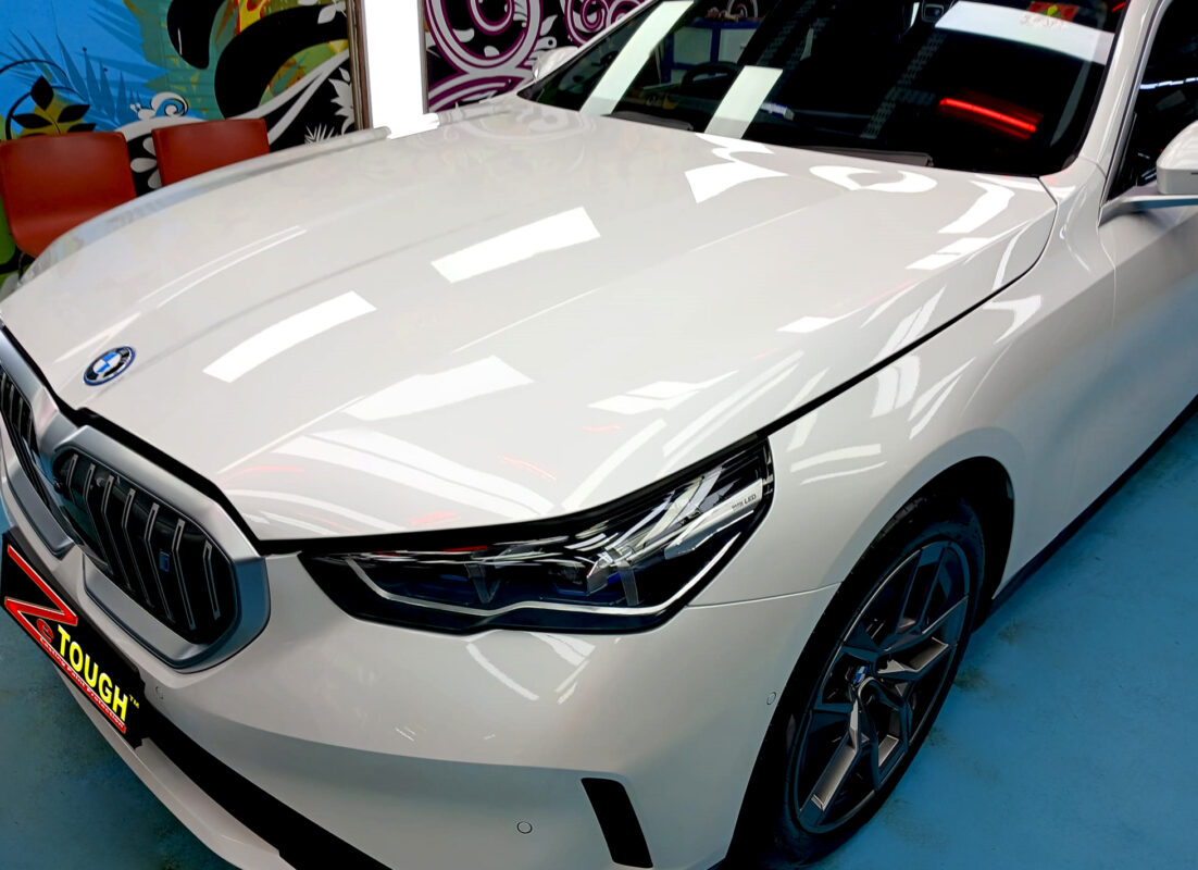 The BMW i5 from a side angle after the titanium coating.