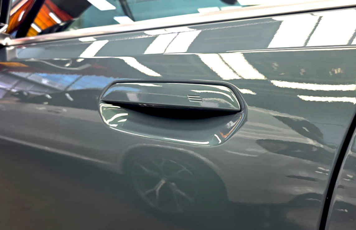 Front three-quarter view of the BMW i5 after coating.