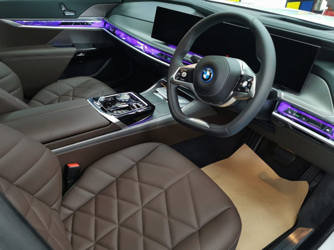 The BMW i7 parked in the workshop, freshly coated.